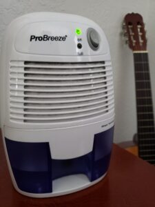 Portrait of a dehumidifier showing heavy accumulation of water and dust