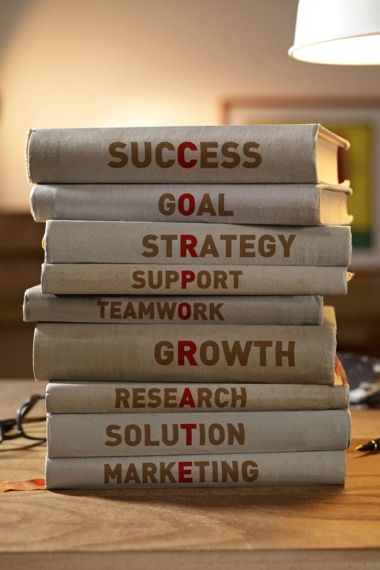 Stack-Of-9-Books-Portraying-Success-Elements-For-A-Company