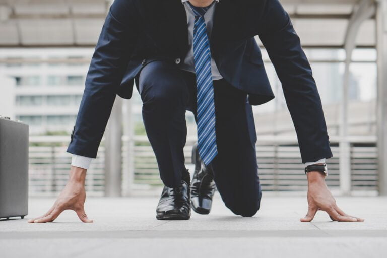 businessman-set-in-start-running-position-prepare-to-fight-in-business-race