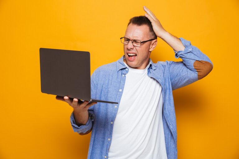 confused-man-using-laptop-computer
