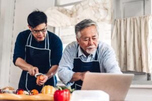 portrait-happy-love-asian-family-senior-mature-father-young-adult-son-having-fun-cooking-together-lo