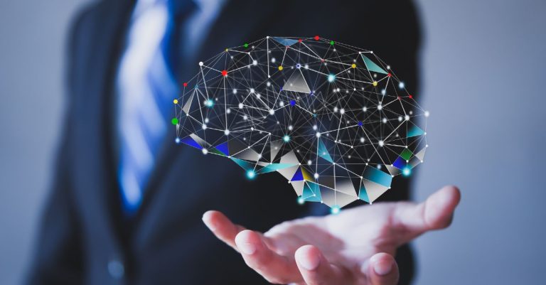 Portrait of a man holding a brain hologram.