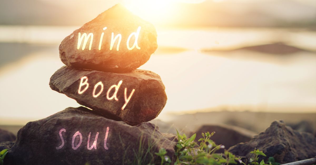 3 rocks showing mind, body and soul words.