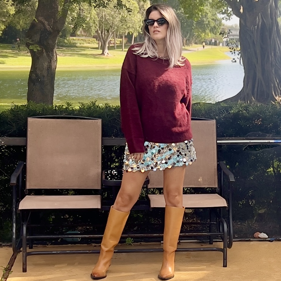 Portrait of Laura wearing a Women's Burgundy O Neck Knitted Sweater Elegant.
