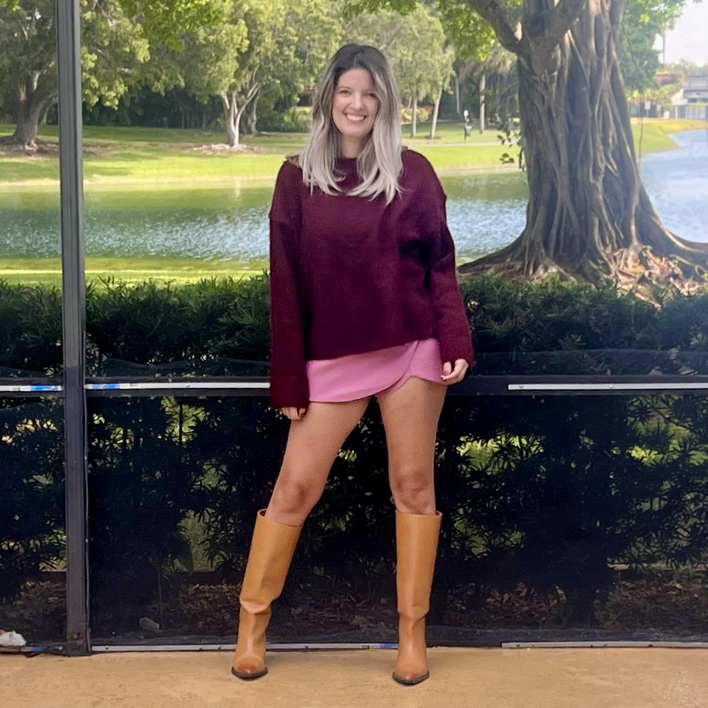 Portrait of Laura wearing a Women's Burgundy O Neck Knitted Sweater Elegant.