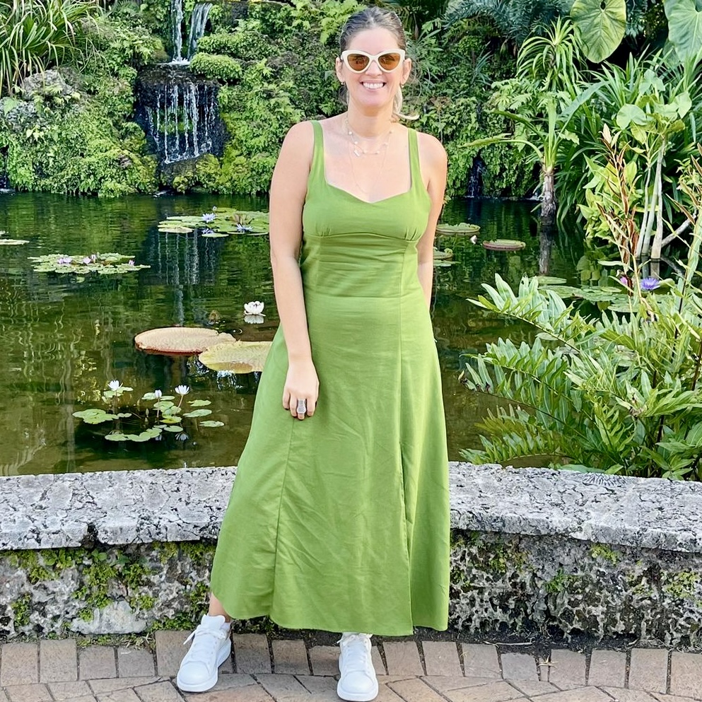 Portrait of Laura wearing a Autumn Sleeveless V Neck Linen Midi Dress.
