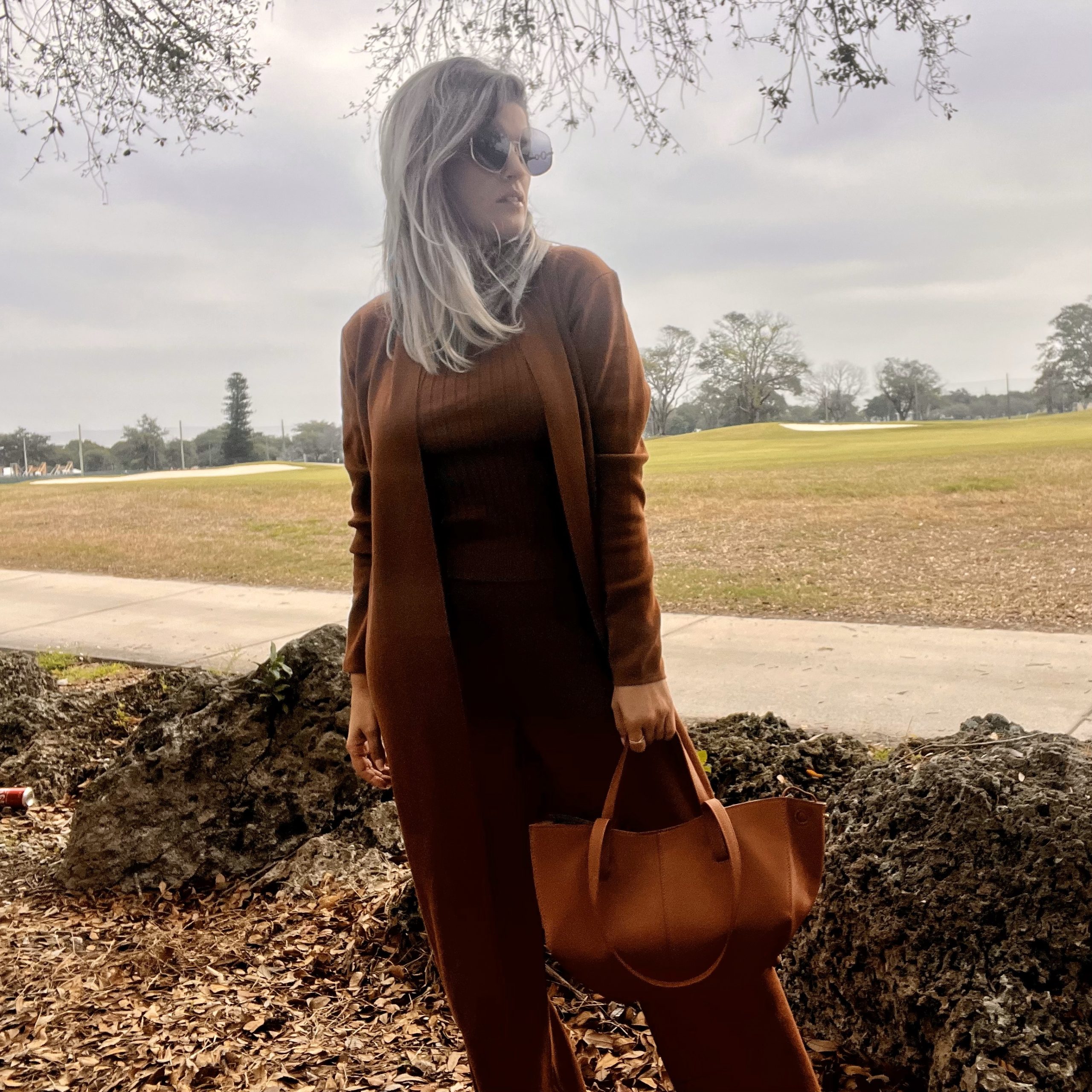 Portrait of Laura wearing a Women's 3 Piece Knitted Cardigan Tracksuit Set.