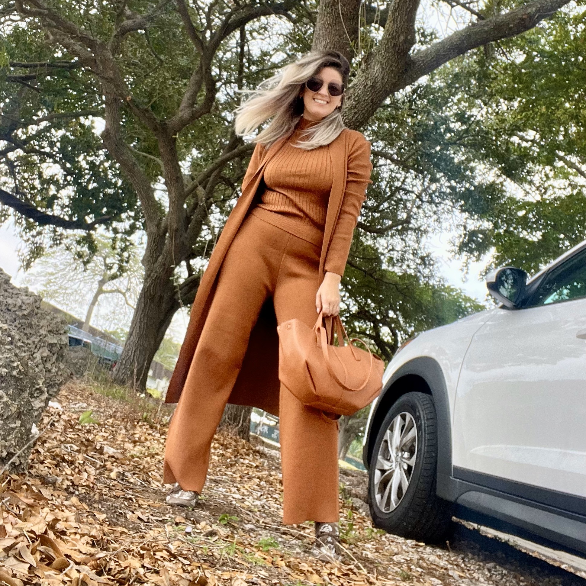 Portrait of Laura wearing a Women's 3 Piece Knitted Cardigan Tracksuit Set.