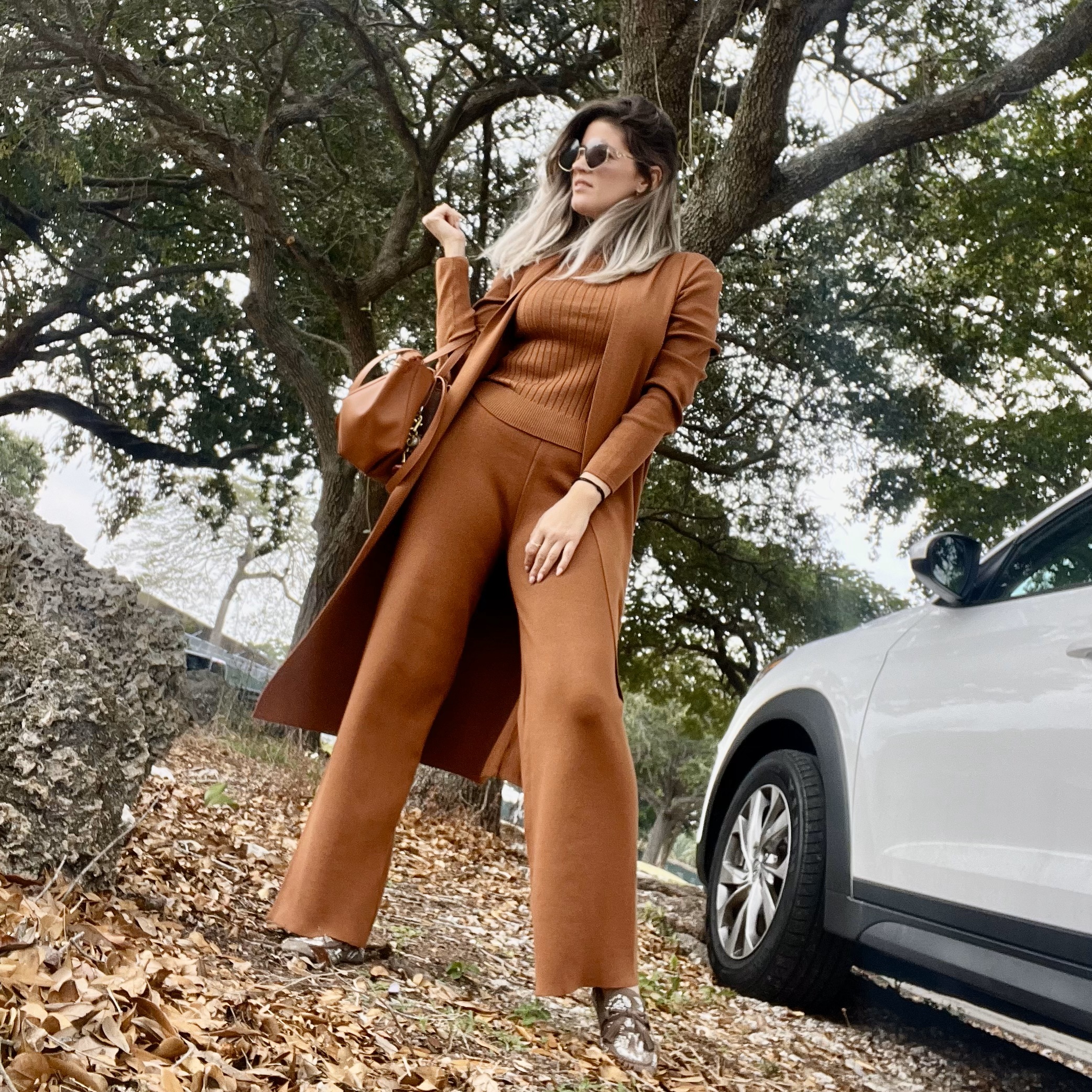 Portrait of Laura wearing a Women's 3 Piece Knitted Cardigan Tracksuit Set.