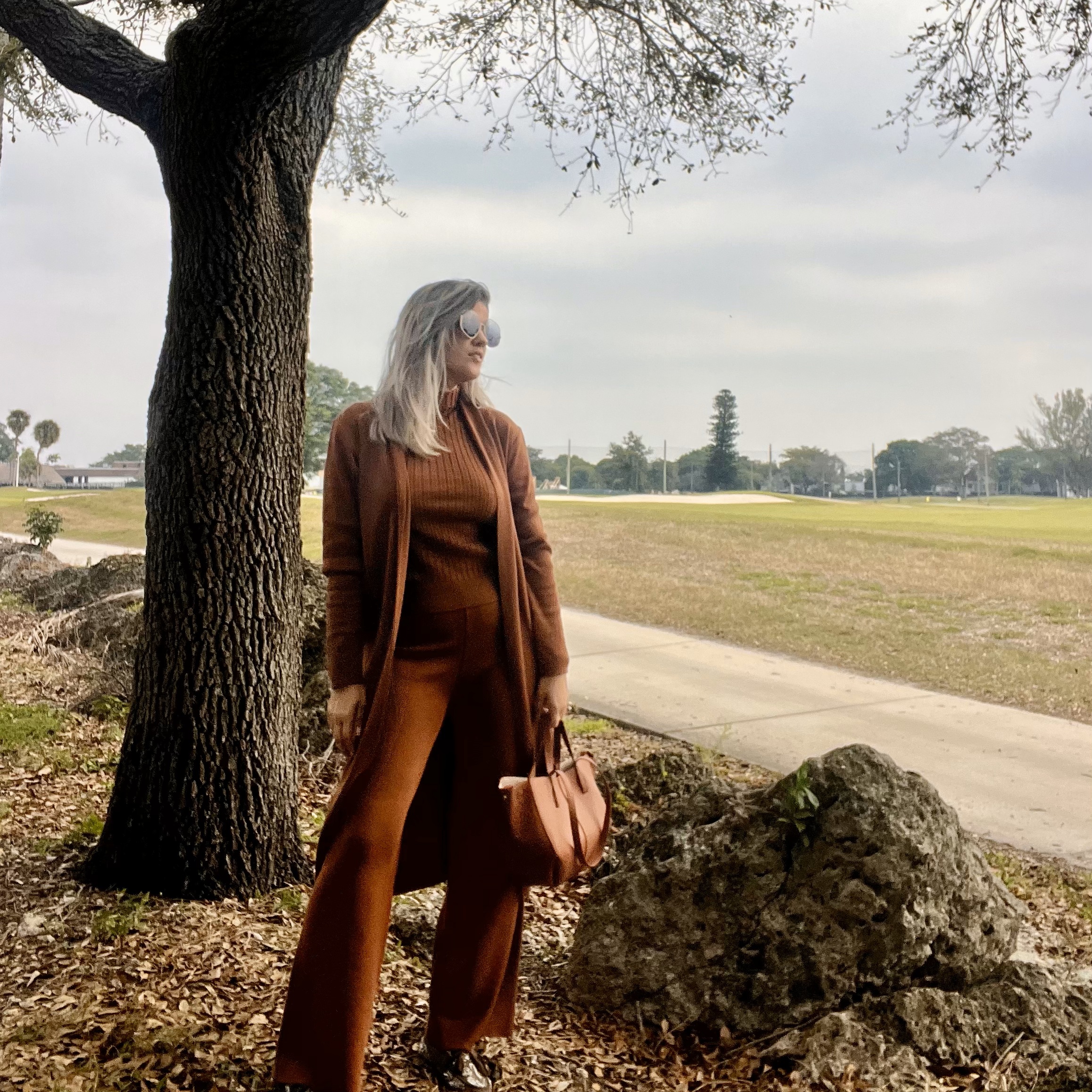 Portrait of Laura wearing a Women's 3 Piece Knitted Cardigan Tracksuit Set.