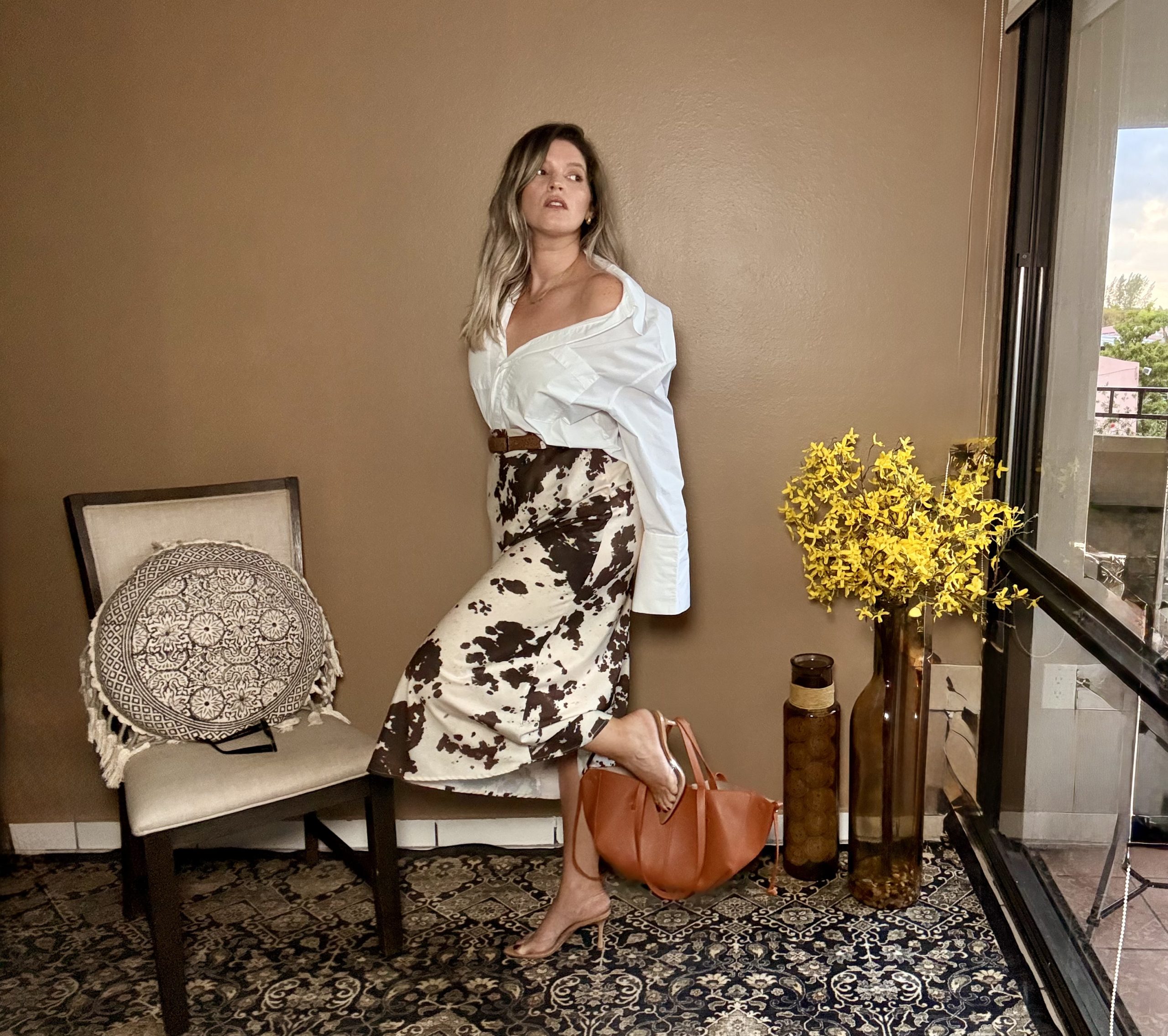 Portrait of Laura wearing a Elegant Y2k Long Sleeve Top & Midi Skirt Set.
