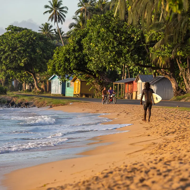 A surfer and cyclists move easily between jungle and sea along Puerto Viejo’s laid-back Caribbean coast.